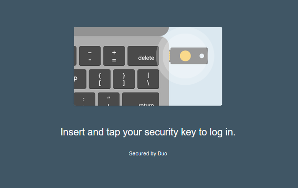 "Insert and tap your security key to log in" windows displayed.