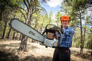 CCC Student Cascade Parcell holding her chainsaw
